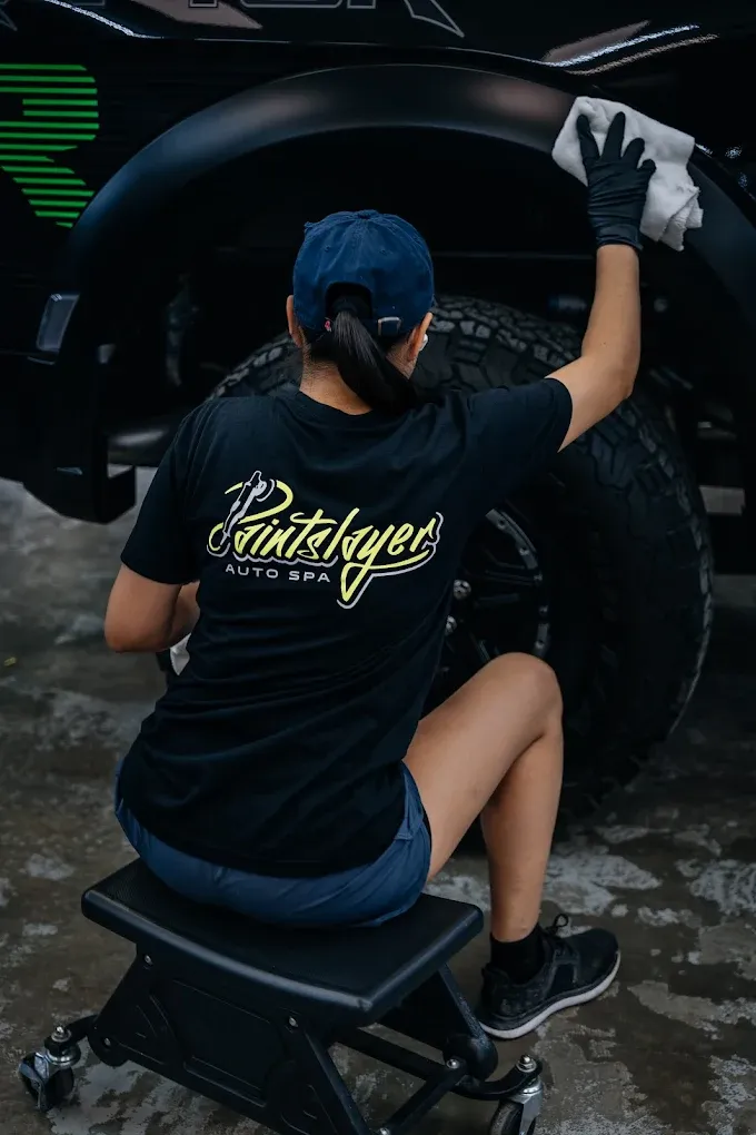 Detailer cleaning wheel with care