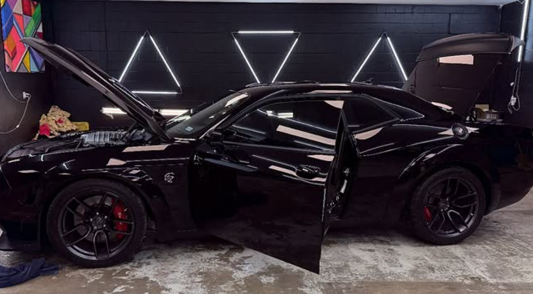Black Challenger with deep gloss finish after paint protection at Paint Slayer Auto Spa