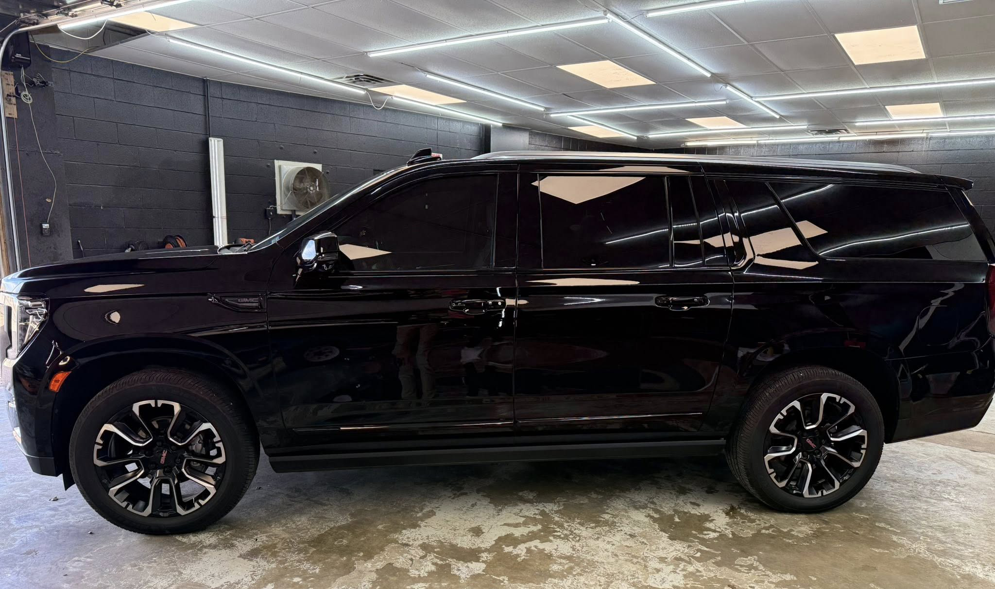 Black SUV with professional window tint at Paint Slayer Auto Spa in Amarillo
