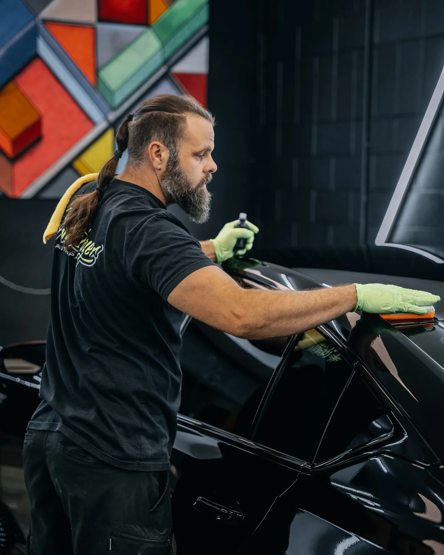 Professional ceramic coating installation at PaintSlayer AutoSpa