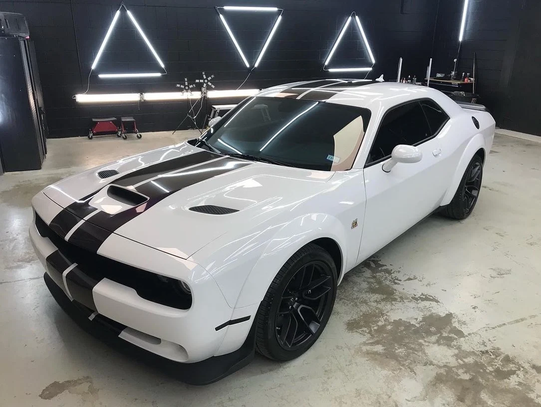 White Challenger in shop after ceramic coating