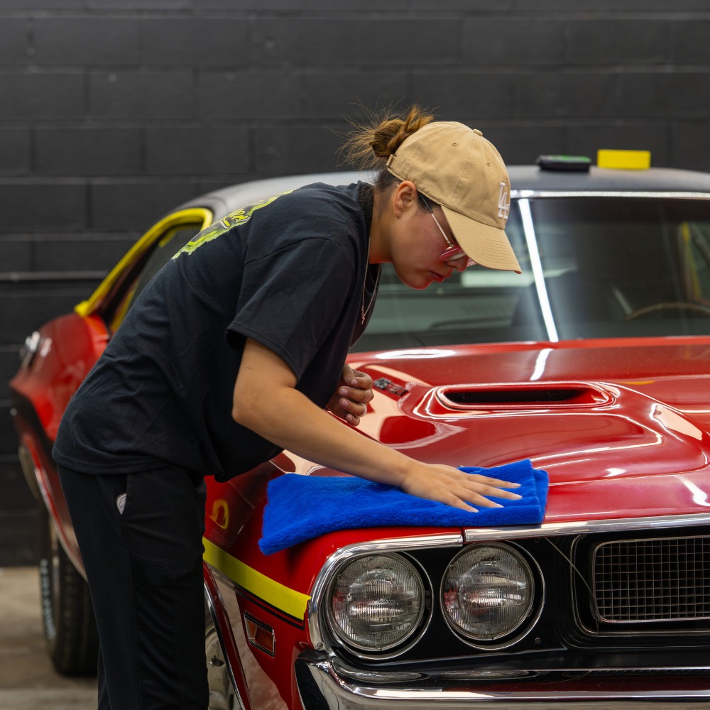 Classic car receiving hand polish and detail