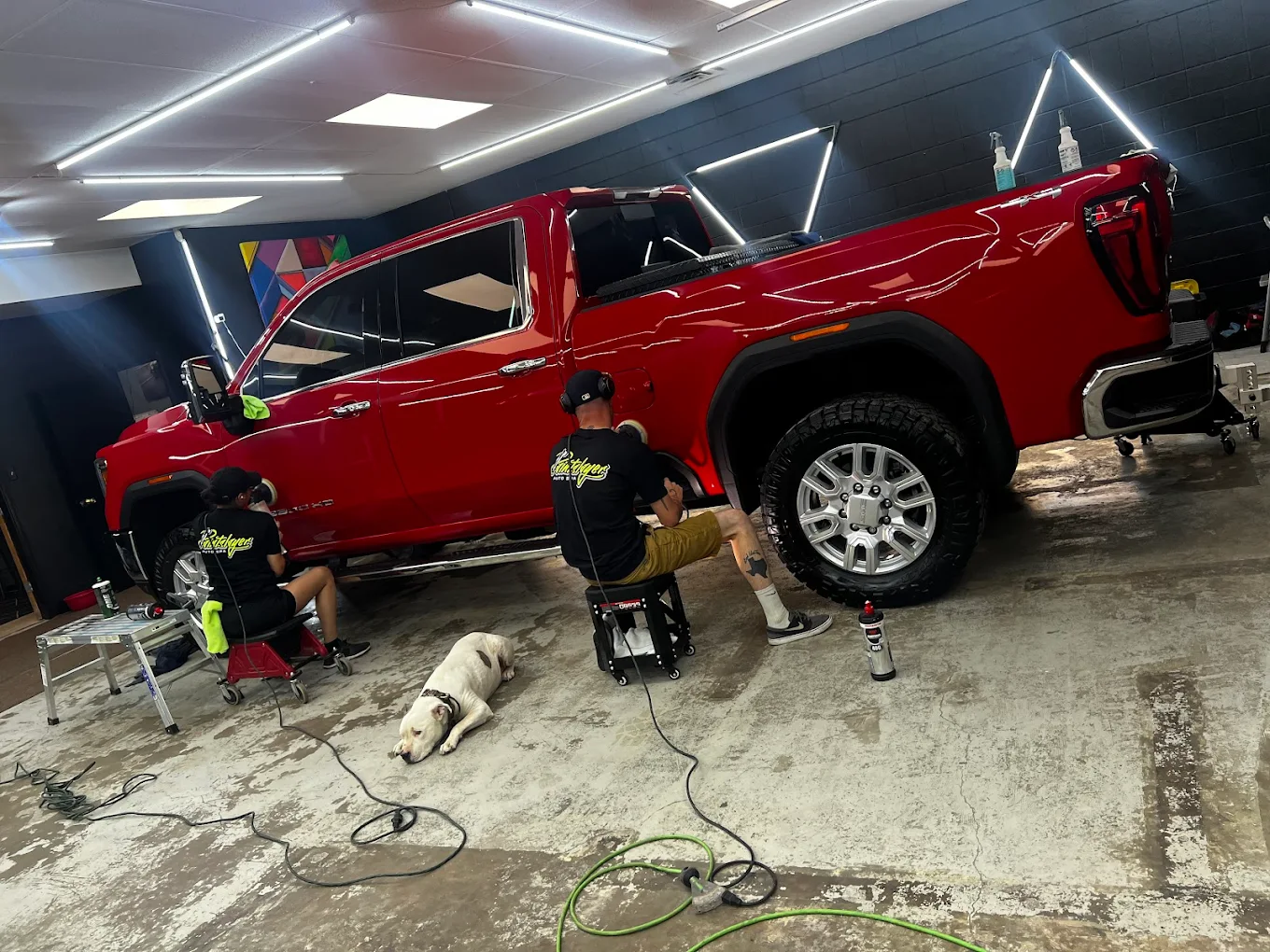 Paint Slayer team detailing a red GMC truck
