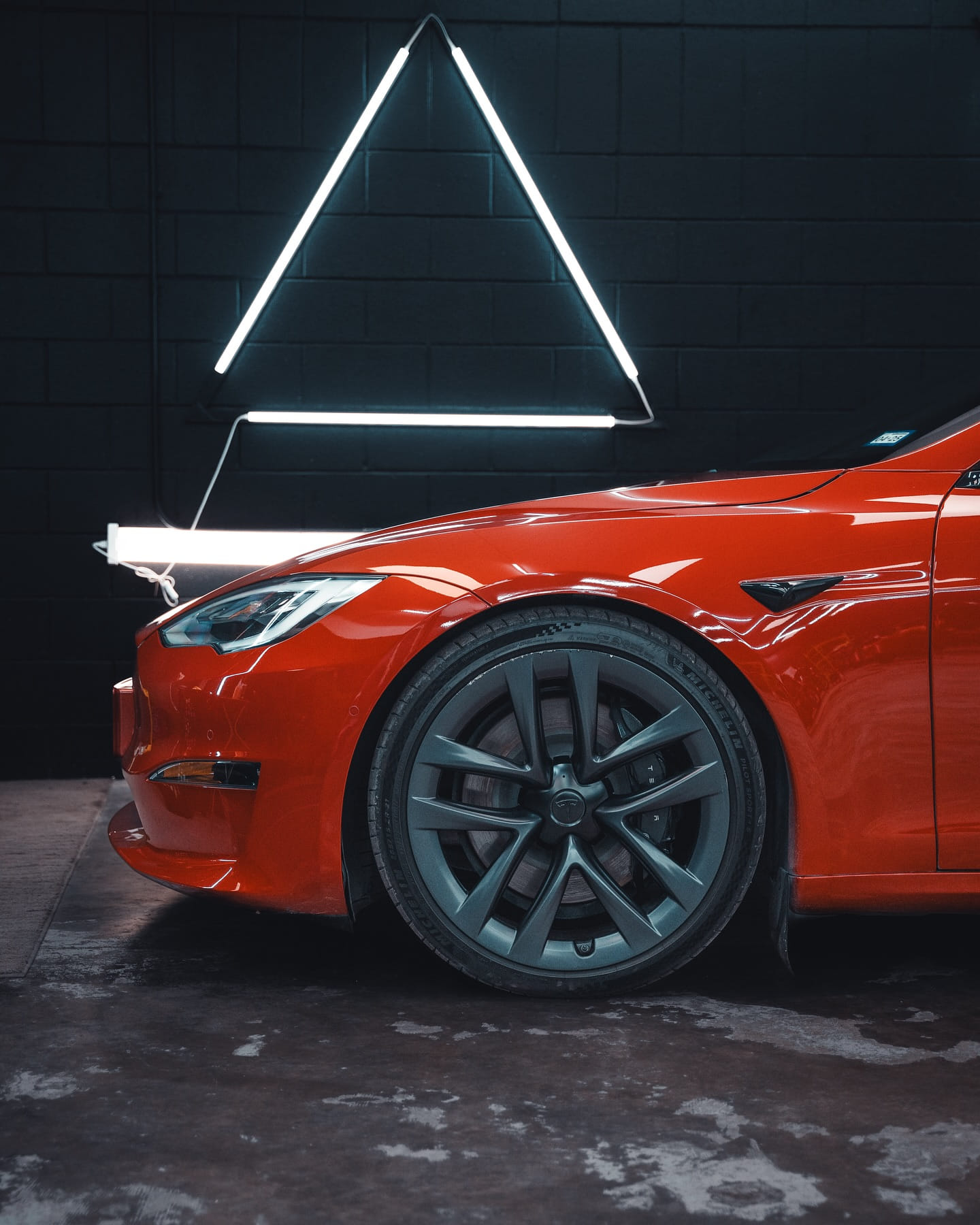 Red Tesla with flawless ceramic coating finish