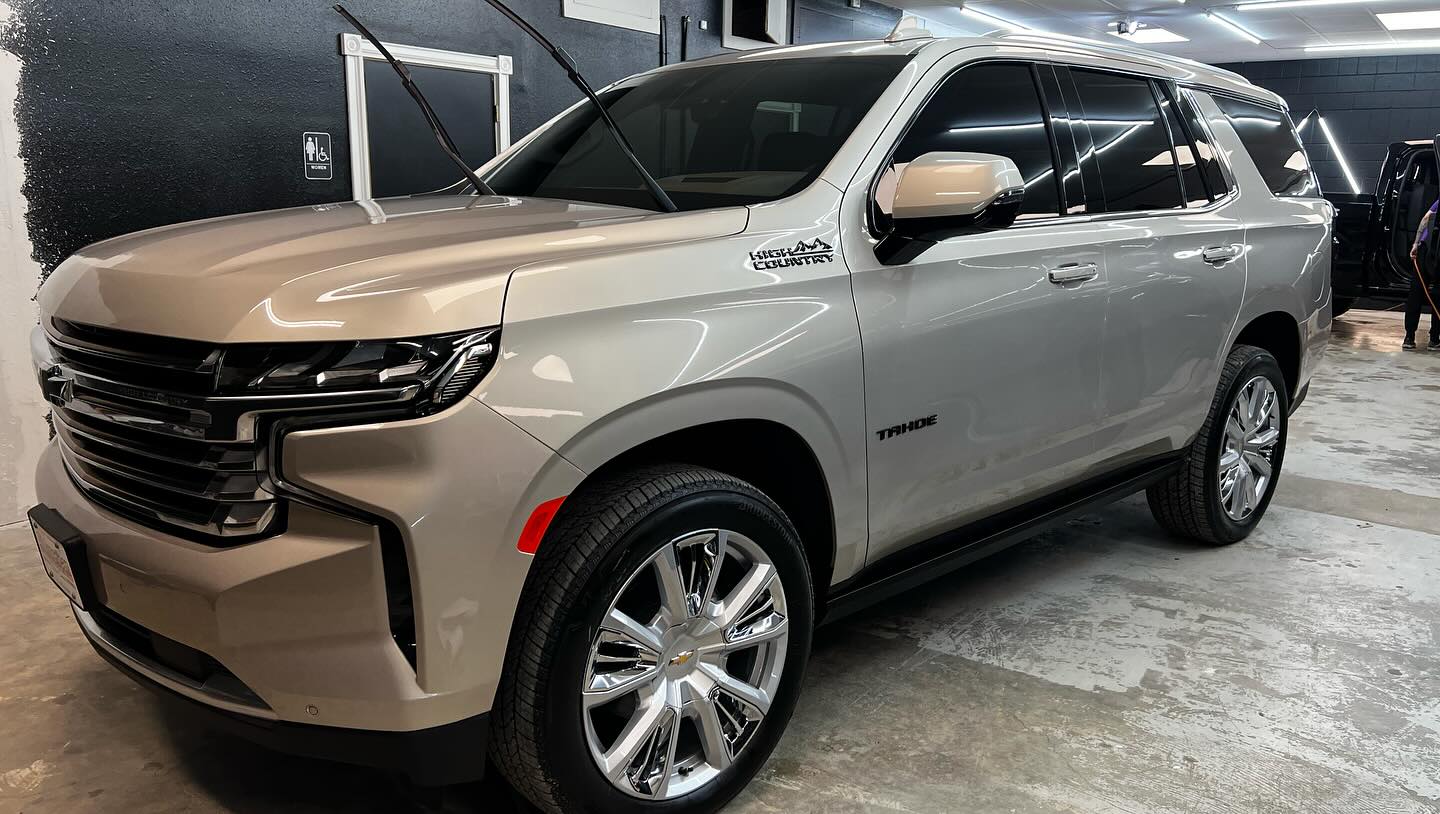 Professional window tint installation at Paint Slayer Auto Spa