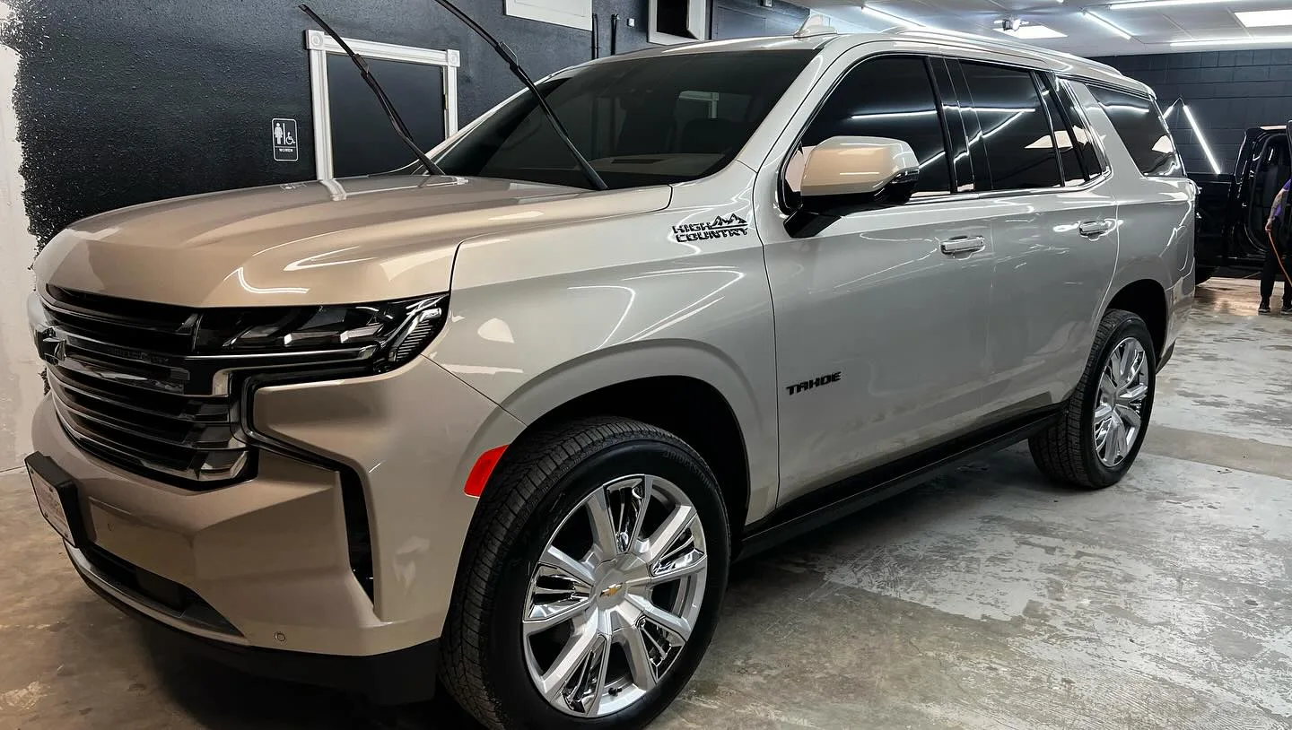 Professional window tint installation at PaintSlayer AutoSpa